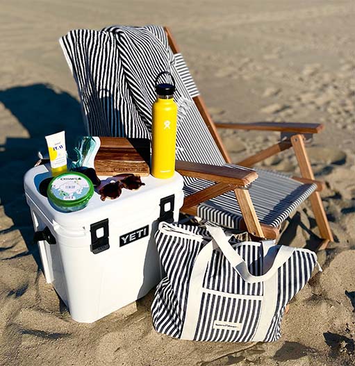 Beach essentials kit with Yeti cooler, chair, bag, and more